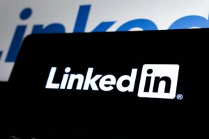 High contrast image of LinkedIn logo displayed prominently on a dark screen.